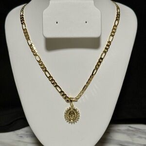 Gold Figaro-Style Chain Necklace with a Virgin Mary charm